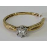 A 9ct gold diamond solitaire ring, illusion set diamond on yellow metal shank hallmarked 375,