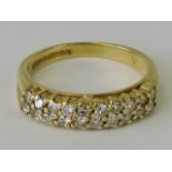 An 18ct gold and diamond double row half eternity ring,