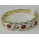 An 18ct gold ruby and diamond five stone woven style ring, size J-K,