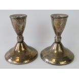 A pair of Sterling silver short candlesticks, stamped Sterling - Duchin Creation - weighted,