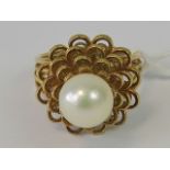 A 14 ct gold filigree flower style ring with central cultured pearl, 14k hallmark, size L, 6.