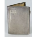 A HM silver cigarette case with gilded interior, Birmingham 1932 - W T Toghill & Co, 8.1 x 6.4cm, 2.