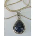 A silver pendant set with large teardrop blue goldstone cabachon, stamped 925,