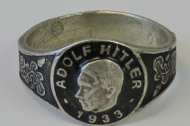 A '1933' black enamel Adolf Hitler ring, stamped 800.