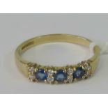 A 9ct gold sapphire and white stone ring,