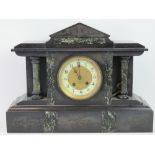 A late 19th century 8 day black slate mantel clock,