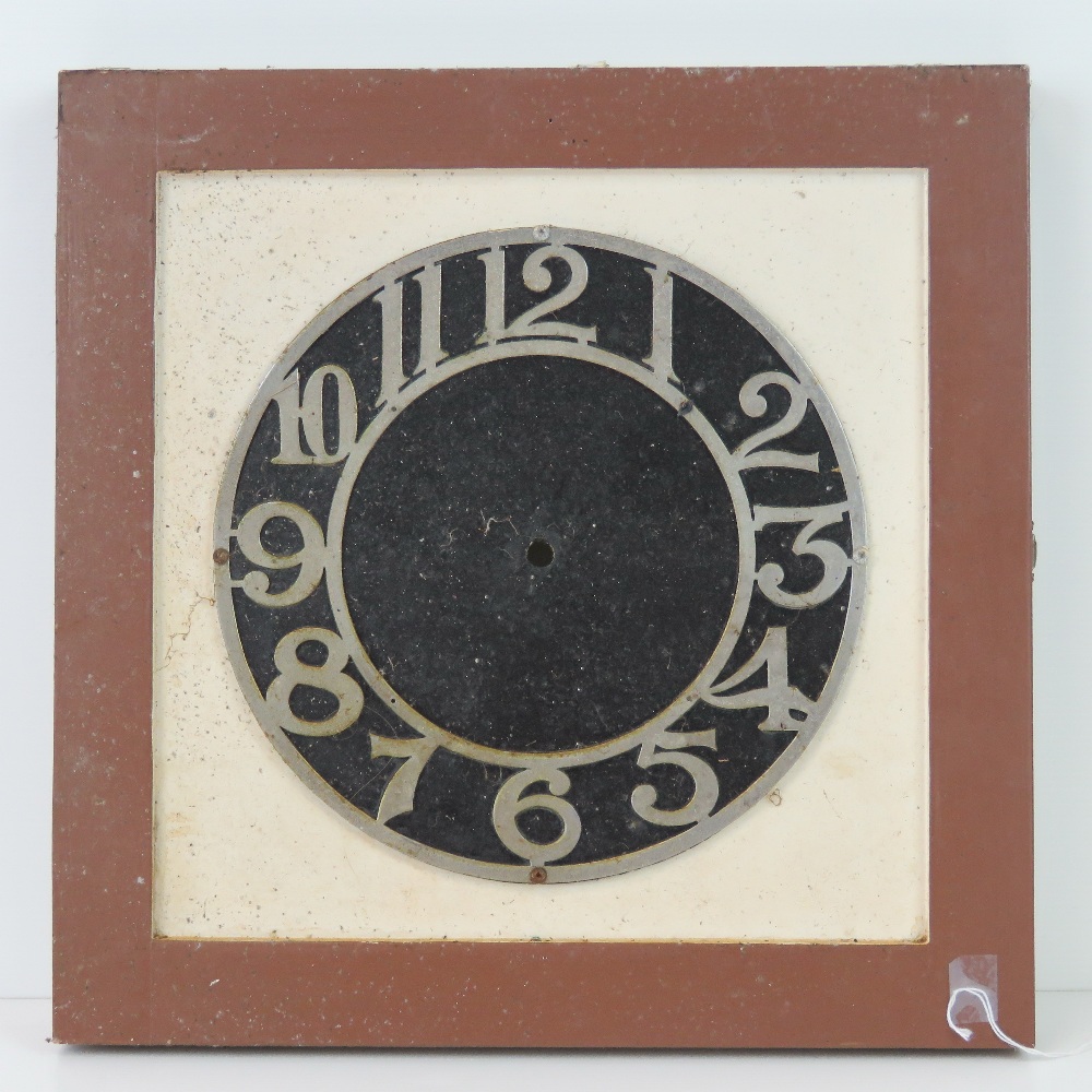 A framed cast metal 10" clock dial having Arabic numerals upon.