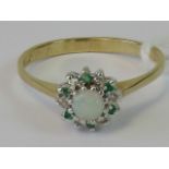 A 9ct gold opal emerald and diamond ring,