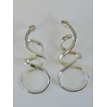 A pair of silver twisted ribbon design earrings, 4.5cm long, stamped 925.