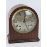 A 20th century, 8 day mantel clock with mahogany case brass silvered Roman numeral dial; 22.