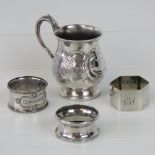 A Victorian white metal cup with single vine handle and engraved design, 3.