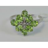A silver and peridot ring,