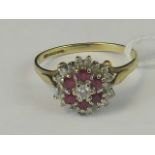 A 9ct gold ruby and diamond three tier cluster ring,