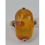 A Russian 14ct gold and amber ring,