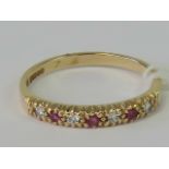 A 9ct gold ruby and white stone ring,