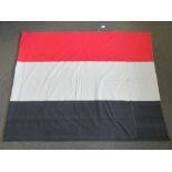 A WWI style German tri-colour flag in bl