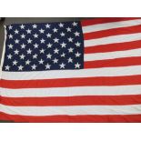 A large US national flag; approximately