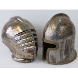 Two reproduction Medieval helmets.
