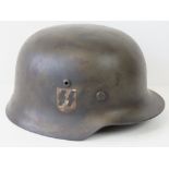 A WWII SS helmet dated 1939, with leathe