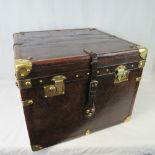 A large vintage Army and Navy type trunk