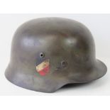 A WWII German helmet with double decal a