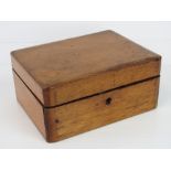 A vintage wooden jewellery or sewing box