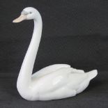 A Lladro figurine of a swan, 22cm high.