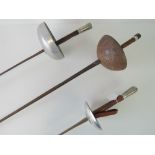 An early 20th century fencing foil and t