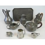 A quantity of pewter items including tea