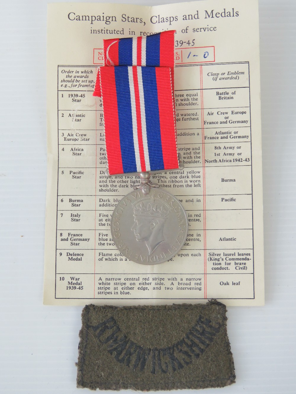 A WW2 1939-45 war medal with ribbon, its