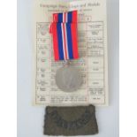 A WW2 1939-45 war medal with ribbon, its