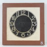 A framed cast metal 10" clock dial havin