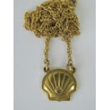 A 9ct gold shell necklace, central shell design panel set with round cut diamond, fancy link chain,