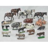 Twelve vintage Britains lead horses,