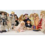 A quantity of thirteen contemporary collectors dolls of various sizes.