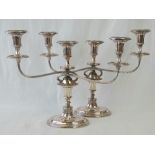 A fine pair of silver plated two-arm, three-sconce candle ticks each standing 30cm and 44cm wide.