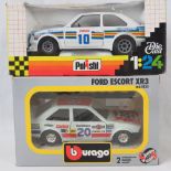 A Burago die-cast model Ford escort XR3 together with another model racing car by Polistil;