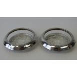 A good pair of glass & Sterling silver edged table salts or bon-bon dishes each 10cm diameter.