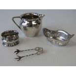 Four HM silver items; a plain cream jug, a pierced bon-bon dish,