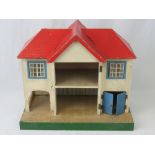 A vintage wooden Tri-ang dolls house; 48cm wide; a/f.