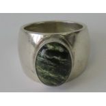 A silver ring set with oval agate cabachon, stamped 925, size L-M.