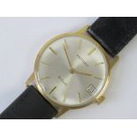 A 9ct gold Rotary manual wristwatch, silvered dial with yellow metal hands and batons,