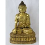 A 19th century gilt bronze seated Buddha figurine standing 25cm high, 17cm wide and weighing 2.58kg.