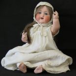 An early 20th century, Armand Marseilles doll with “990 A 14 M” impressed mark,