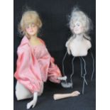 A mid 20th century doll upper body section of a doll with bisque head and hands (19cm high) and