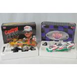 An Action Racing model Castrol GTX John Force NHRA Funny car together with another John Force