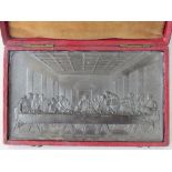 A bronzed lead plaque depicting the 'Last Supper', signed lower left F.