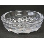 A Skruf moulded glass dish signed "Hellsfen Skruf H L C 1-2" to its rim; 15.5cm diameter.