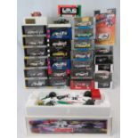 Over 20 die-cast models of racing cars Over 40 die-cast model racing cars all with original