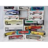 A collection of 16 various die-cast metal (with some plastic)motor sport transporters;